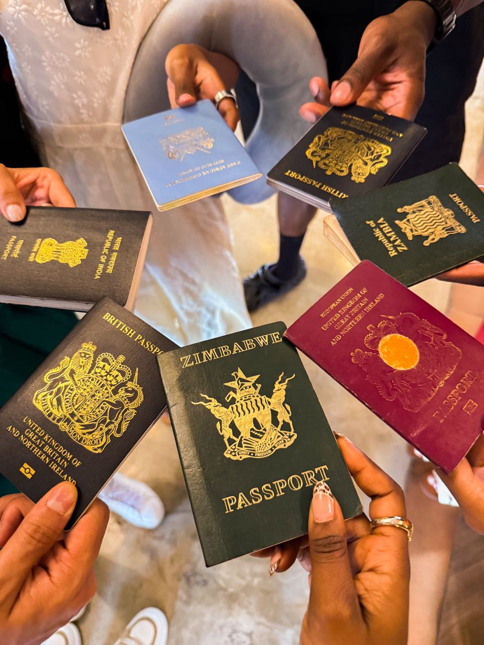 Travellers holding passports from several countries together